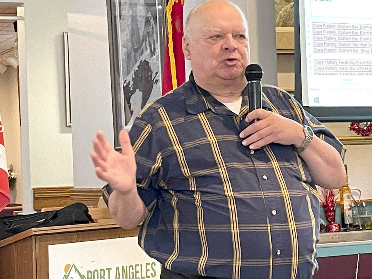 Photo by Paula Hunt/Olympic Peninsula News Group / Jim Buck, the 24th Legislative District representative from 1995-2007, lays out what he called the deadly risk that old and seismically unsafe school buildings in Washington pose for children in grades K-12 at a Port Angeles Business Association meeting in July.