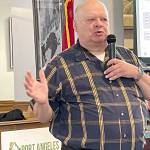 Photo by Paula Hunt/Olympic Peninsula News Group / Jim Buck, the 24th Legislative District representative from 1995-2007, lays out what he called the deadly risk that old and seismically unsafe school buildings in Washington pose for children in grades K-12 at a Port Angeles Business Association meeting in July.