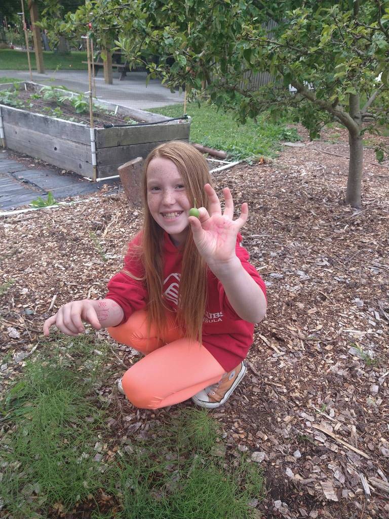 Submitted photo
Linda Schroeder, a Boys & Girls Club member, visits the Woodcock Demonstration Garden by Clallam County Master Gardeners during a recent field trip.