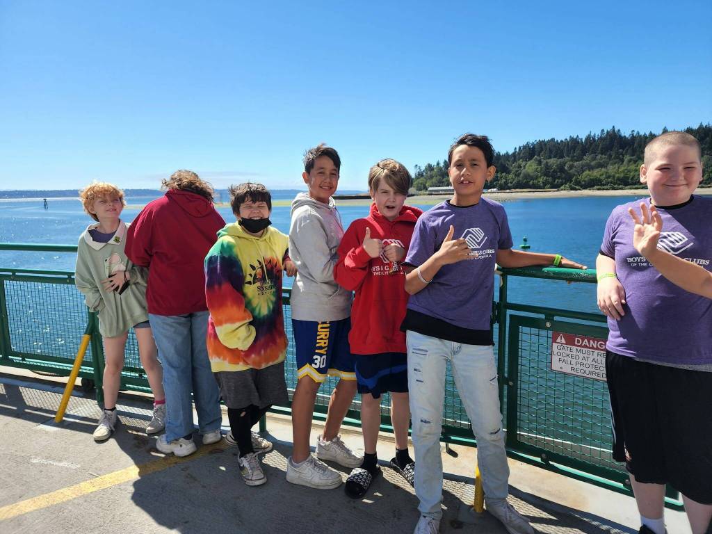 Submitted photo
Boys & Girls Club members, from left, Bee Mao, Paisley Taylor, Hunter Carleson, Daniel Salanoa, Russell Thomas, Alex Salanoa, and JD Kessler, enjoy a ferry ride on the way to a Seattle Storm basketball game.