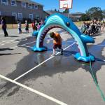 Submitted photo
Club members with the Boys & Girls Club of Sequim stay cool and celebrate Shark Week with an inflatable shark on their playground.
