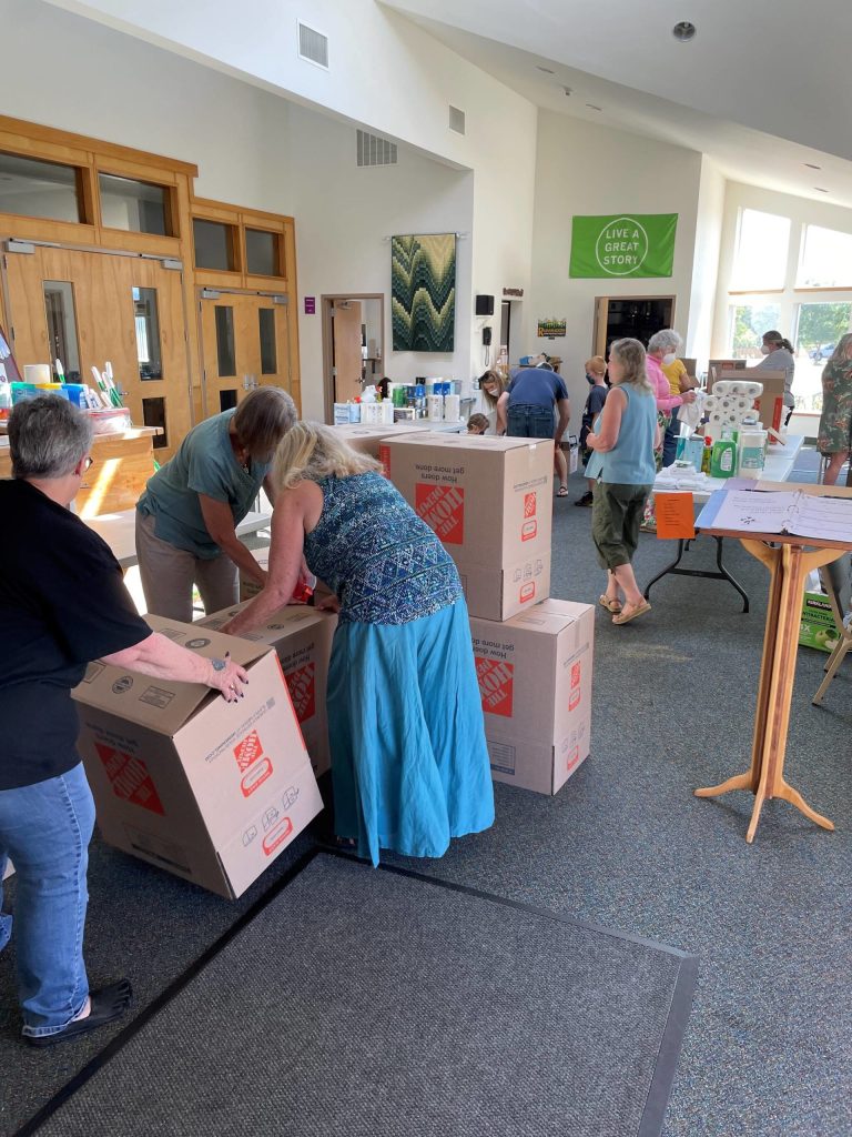 Photo courtesy of Dungeness Valley Lutheran Church
Volunteers compile kits with housewares at Dungeness Valley Lutheran Church on July 26 for Ukrainian refugees now in Washington.