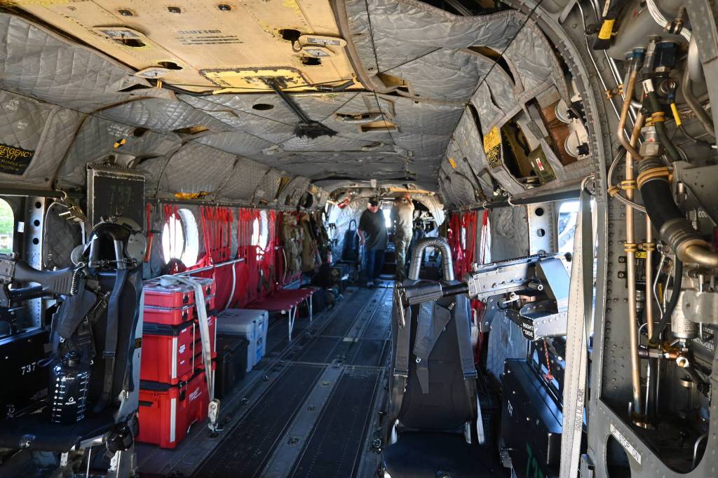 Sequim Gazette photo by Michael Dashiell / Attendees of the 2022 Unity of Effort event, held Aug. 6 at Security Services Northwest, get an inside look at a special forces Chinook helicopter.