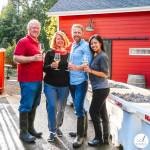 Photo courtesy of Seabeck Cellars
Scott Rants and his wife Ravynn, at right, and Rants parents Lynda and Steven, help bring Seabeck Cellars fine wines to the Sequim Farmers & Artisans Market each Saturday.