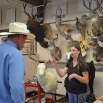 Sequim Gazette file photo by Michael Dashiell / Elizabeth Barrett of West End Taxidermy talks with a fair-goer at the Clallam County Fair in 2019; Davis is part of the Happy Tails 4-H Club.