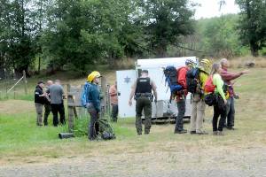 Keith Thorpe/Olympic Peninsula News Group
A Jefferson County Search and Rescue team waits at a Jefferson County Sheriffs Office command post plans are developed to access the site of a plane crash on Aug. 10, just southwest of Gardiner.