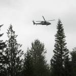 Keith Thorpe/Olympic Peninsula News Group / A rescue helicopter from Naval Air Station Whidbey Island circles the area where a plane crashed on Aug. 10 in forested terrain southwest of Gardiner.