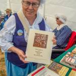Sequim Gazette photo by Emily Matthiessen / Lynn Maynard of Centralia, with the Sacajawea Chapter of Daughters of the American Revolution in Olympia, explains that the DAR is trying to enroll more descendants of African American, Native American, French and Spanish participants participants of the American Revolution to join their organization. Maynard also spoke to families about spices and why the pineapple became a symbol of hospitality in the Eastern United States. Its a blast, she said, referring to volunteering at the PNW Colonial Festival. I get to talk to people and share about history. Her ancestor, Basille Perraut, was French Canadian.