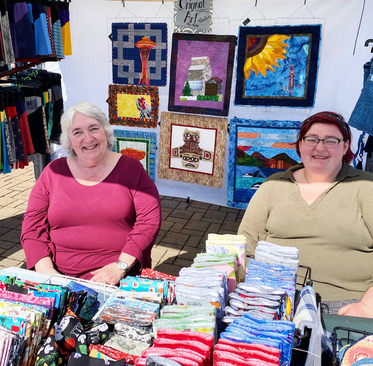 Photo by Emma Jane Garcia/Sequim Farmers & Artisans Market
Libby Ballard, left, pictured with her granddaughter Taylor Dowley, greets visitors at her Bountiful Pleasures booth the Sequim Farmers & Artisans Market.
