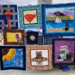 Photo by Emma Jane Garcia/Sequim Farmers & Artisans Market / Libby Ballards hand-crafted, upcycled, and environmentally friendly clothing, aprons, bags, fabric household essentials and art quilts are on display at the Sequim Farmers & Artisans Market.