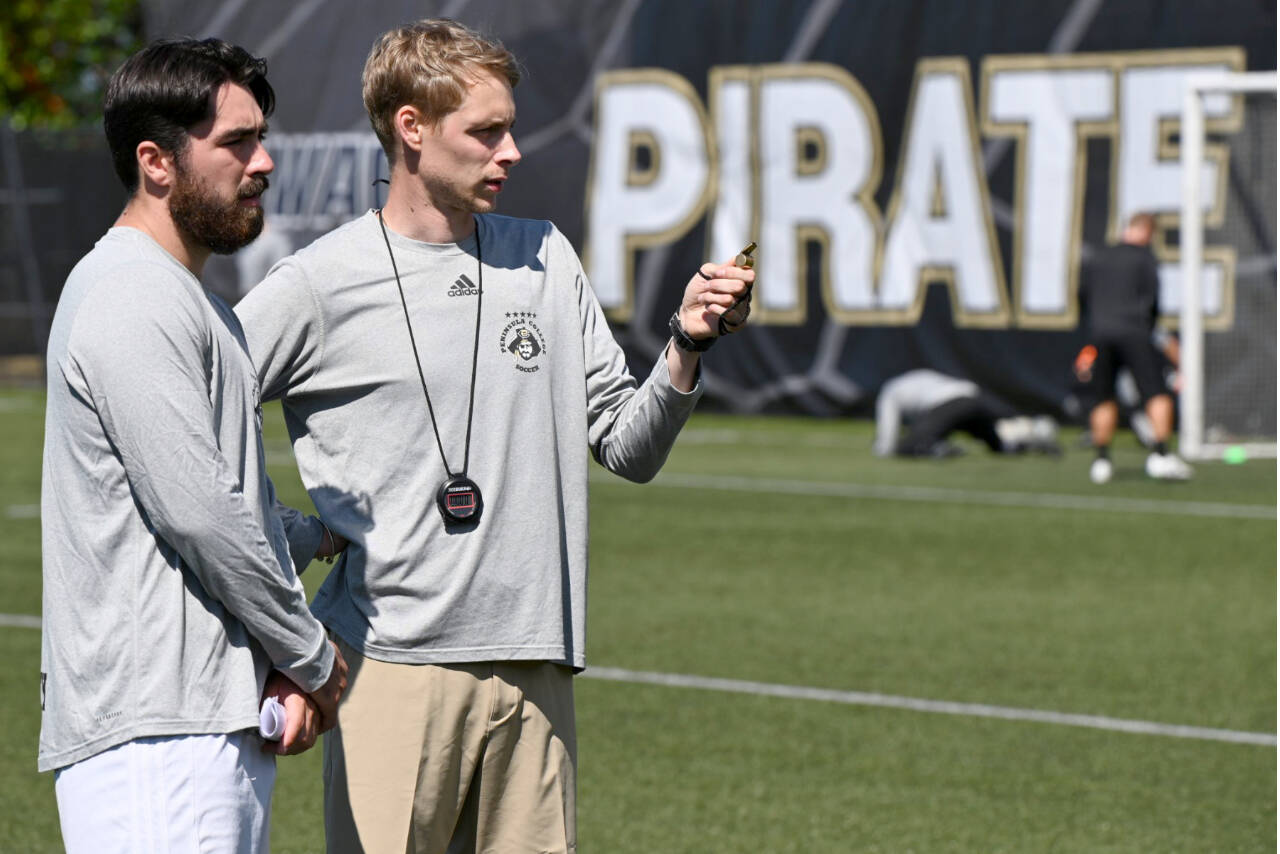 Photo courtesy of Peninsula College
Peninsula College mens soccer coach Jake Hughes, right, talks with assistant Jesse Salgado during a preseason practice earlier this month.