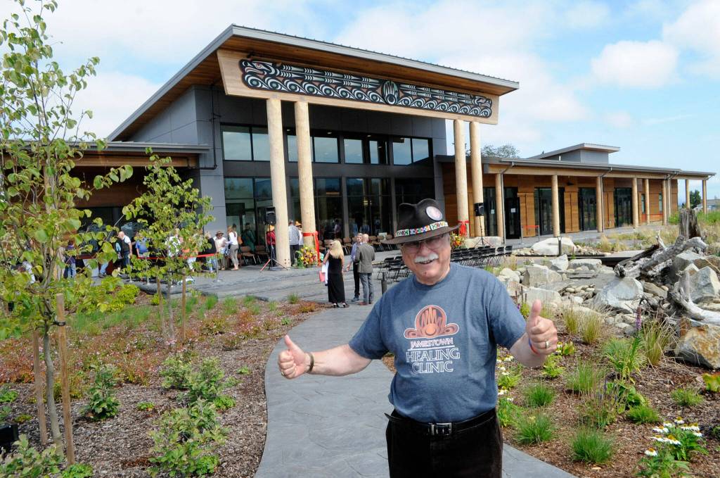 Tim Wheeler gives thumbs up while wearing the Jamestown Healing Clinics first T-shirt after a grand opening ceremony on Aug. 20. Wheeler, a Sequim High graduate and with the group Voices for Health & Healing, said this is one of the best recognitions of his life. Brent Simcosky, the tribes health services director, said Wheeler was a big supporter of the tribe and the clinic, and the first in line at a forum they held to speak in support.