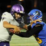 Sequim Gazette file photo by Michael Dashiell
Sequim quarterback Lars Wiker looks to break free of a tackle in an Olympic League game at Bremerton in 2021.