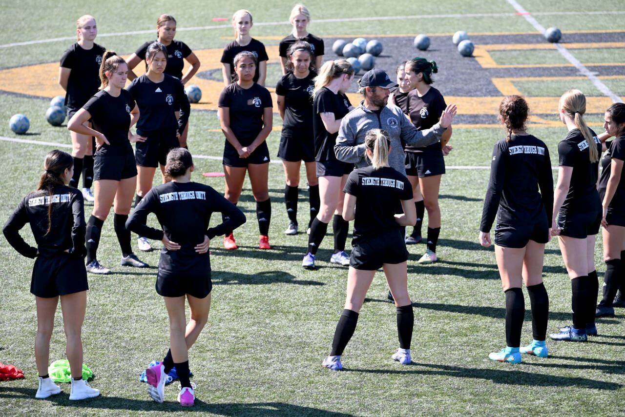 Photo courtesy of Peninsula College
Coach Kanyon Anderson works with members for the Peninsula College womens soccer team at a practice earlier this month. The Pirates are defending NWAC champions.