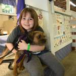 Genesis Freeman, 6, of Port Angeles, holds Hope, her 16-month-old terrier, at the Clallam County Fair on Aug. 18.
