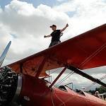 Sammy Mason, 12, stands atop his familys Stearman plane that they use for Mason Wing Walking lessons. His mom Marilyn said their son James, 15, went up for a flight during the Air Affaire with his dad Mike. Sammy will likely go on his first wing walking adventure before the end of the year. They know it inside and out, she said. Im nervous a little bit, but Im ready to fly, Sammy said. Ive been riding along with them since I was 4.
