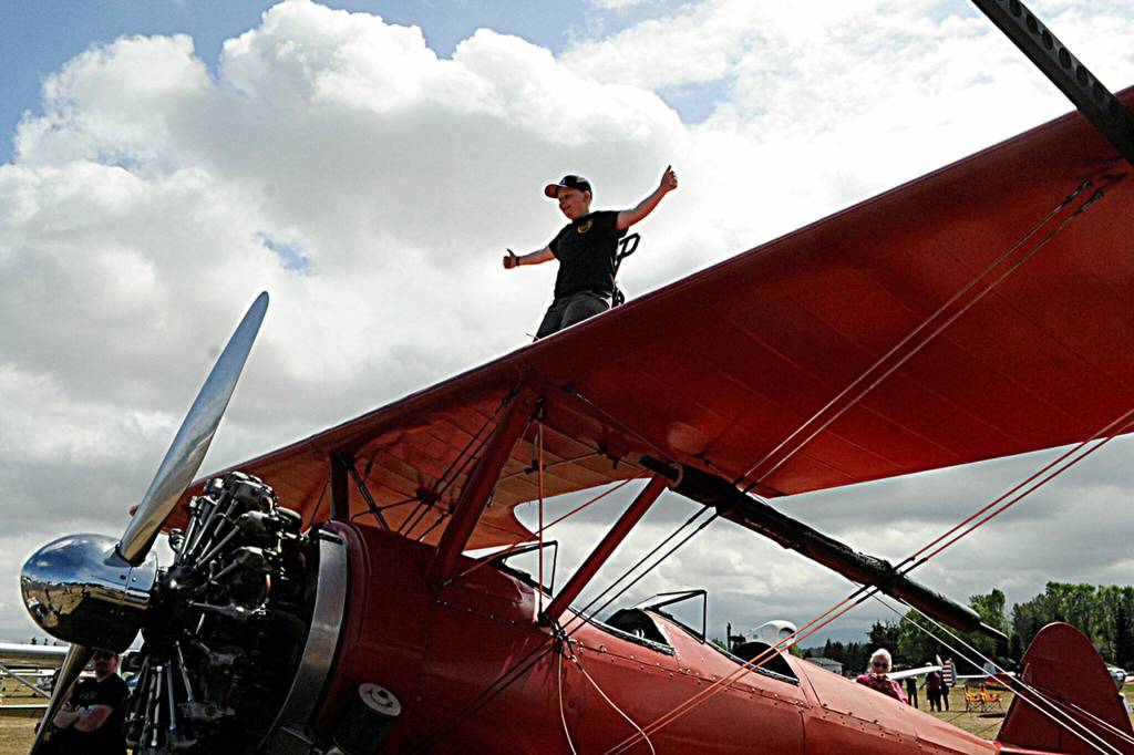 Sammy Mason, 12, stands atop his familys Stearman plane that they use for Mason Wing Walking lessons. His mom Marilyn said their son James, 15, went up for a flight during the Air Affaire with his dad Mike. Sammy will likely go on his first wing walking adventure before the end of the year. They know it inside and out, she said. Im nervous a little bit, but Im ready to fly, Sammy said. Ive been riding along with them since I was 4.