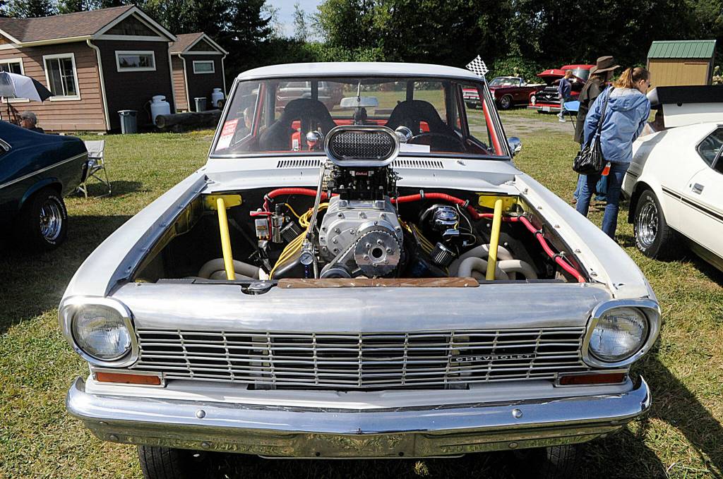 Sequim Gazette photo by Matthew Nash/ Guy Bud Hoy III and Guy Bud Light Hoy IV of Port Townsend brought their 1963 Chevy 2 to the Air Affaire on Aug. 27 that they built together over three years.
