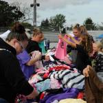 Sequim Gazette photo by Matthew Nash/ Donated childrens clothes were a popular draw at the Back to School Fair. It was one of many attractions, including many community booths and a drive through for school supplies.