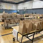 Sequim Gazette photo by Matthew Nash/ As part of the Back to School Fair drive through, participants could pick up school supplies for this year from the Boys & Girls Club.