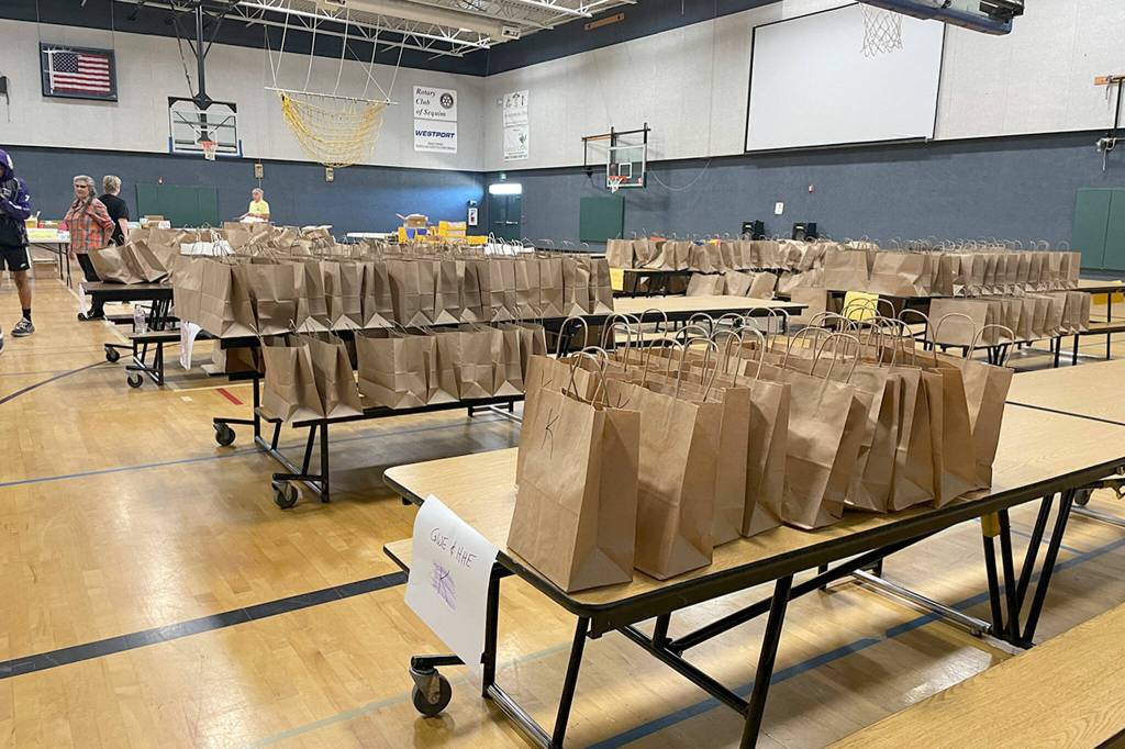 Sequim Gazette photo by Matthew Nash/ As part of the Back to School Fair drive through, participants could pick up school supplies for this year from the Boys & Girls Club.