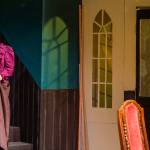 Sequim Gazette photo by Emily Matthiessen / Tara Dupont plays homicidal Martha Brewster in Arsenic and Old Lace, OTAs upcoming production directed by Steve Humphrey. Shadow and light are used to great effect on the set. Dupont said, I like the way the aunties are thinking theyre doing these men a service.