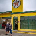 Sequim Gazette photo by Emily Matthiessen / Christopher Burris and his sister Kim Burris stand outside the Texaco their grandfather used to own, which Burris now rents to operate Exquisite Reflection Details, his auto-detailing business, which moved to the 154 E. Washington St. address in early August.