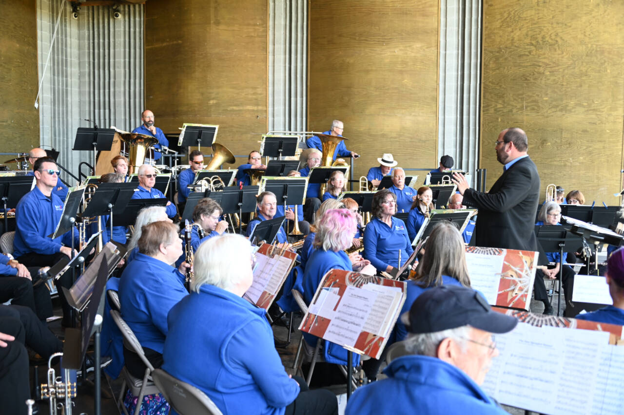 Photo courtesy of Richard Greenway, Sequim City Band/Sequim City Band
Tyler Benedict directs Sequim City Band members at the groups Aug. 14 concert. The band is back at the James Center on Saturday, Sept. 10, as part of KSQM 91.5 FMs Music Where You Bark concert.