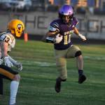 Sequims Aiden Gockerell looks to a tackle by Forks Ryan Rancourt in the first half of the Wolves season-opener at home on Sept. 2.
