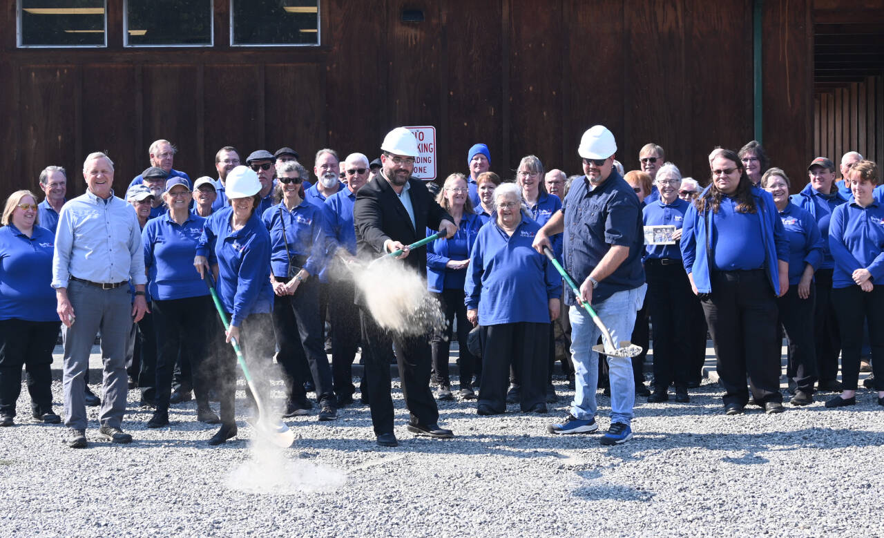Sequim Gazette photo by Michael Dashiell
Sequim City Band members break ground on the Rehearsal Hall expansion project on Sept. 10. Pictured with ceremonial shovels are, from left, band president Debbi Soderstrom, band director Tyler Benedict and Neeley Construction superintendent Eli Collier.