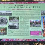 Sequim Gazette photo by Matthew Nash/ Sequim Prairie Garden Club members welcome park visitors to see a new outdoor historical sign by the back parking area. Jessica Diewald of In Graphic Detail designed the sign that shares the history of Sequim Pioneer Memorial Park.
