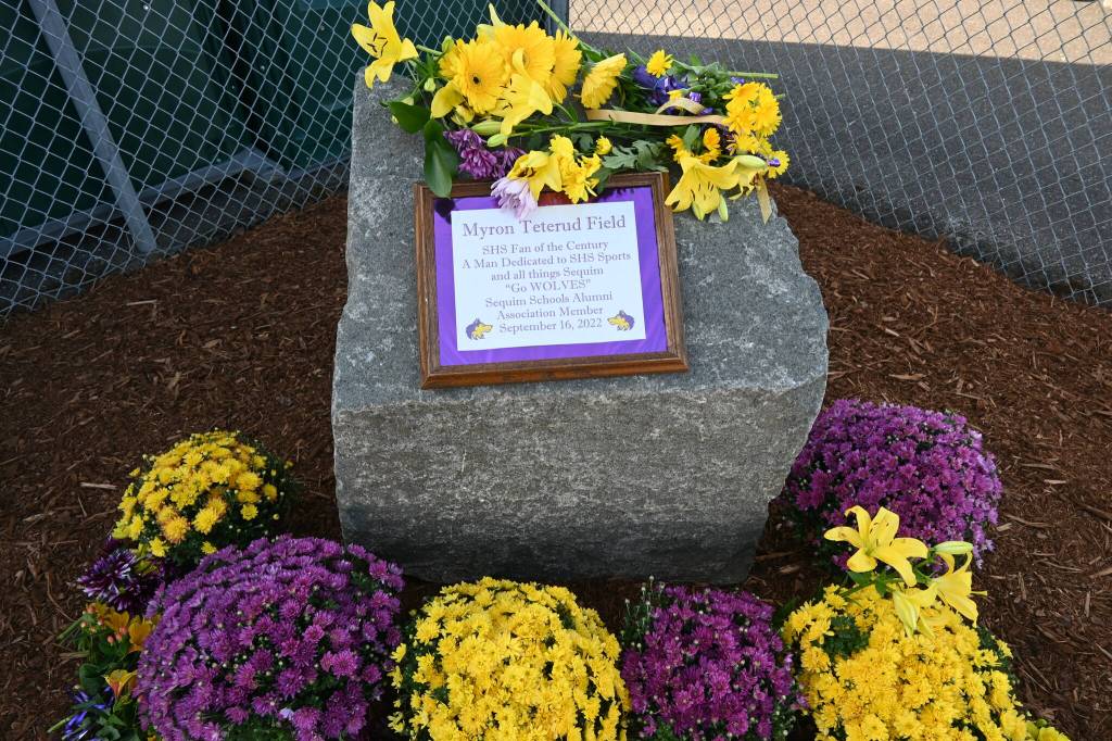 Sequim Gazette photo by Michael Dashiell
A large rock and plaque just outside the gates of the newly named Sequim School District stadium and field recognizes Sequim High superfan Myron Teterud.