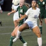 Photo by Keith Thorpe/Olympic Peninsula News Group / Port Angeles Anna Petty, left, fights for a loose ball with Sequims Jennyfer Gomez on Sept. 15 in Port Angeles.