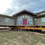 Sequim Gazette photo by Matthew Nash/ This Dungeness home was placed about 120 feet from the hillside on Sept. 16. Crews will work on utilities and foundation work in the coming month.