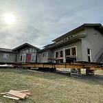 Sequim Gazette photo by Matthew Nash/ This Dungeness home was placed about 120 feet from the hillside on Sept. 16. Crews will work on utilities and foundation work in the coming month.