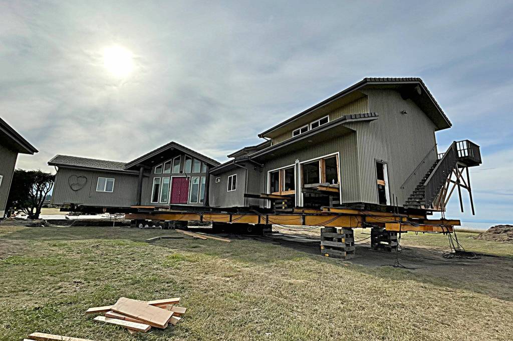 Sequim Gazette photo by Matthew Nash/ This Dungeness home was placed about 120 feet from the hillside on Sept. 16. Crews will work on utilities and foundation work in the coming month.