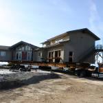 Nickel Bros crewmembers begin to move a Dungeness home away from the bluff on Sept. 16. Homeowners anticipate being back in the house by October.