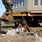 Sequim Gazette photo by Matthew Nash/ Large wooden planks helped Nickel Bross crew to better move a Dungeness home on Sept. 16.
