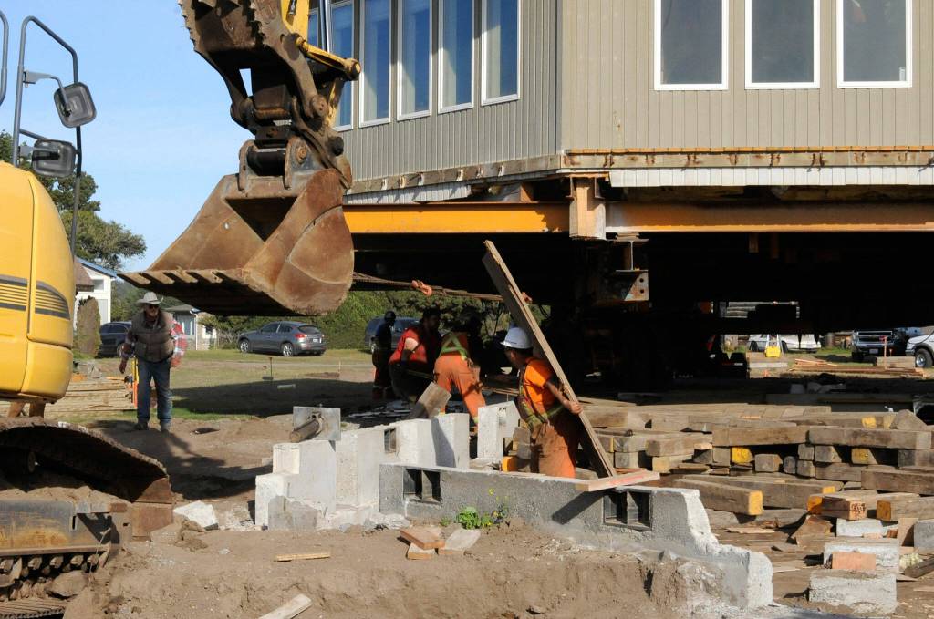 Sequim Gazette photo by Matthew Nash/ Large wooden planks helped Nickel Bross crew to better move a Dungeness home on Sept. 16.