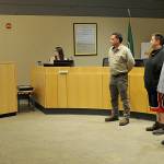 Sequim Gazette photo by Matthew Nash/ Sequim Police chief Sheri Crain tells, from front left, Ryan Ross, Daniel Anselmo, and James Mike Blouin on Sept. 12 that Its incredibly heartwarming and reassuring to our staff that there are people in our community who are willing to put themselves at risk for us after they helped an officer when he was attacked during a traffic stop in May.