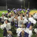 Photo by Keith Thorpe/Olympic Peninsula News Group / Members of the Sequim Wolves football team and cheer squad celebrate a 36-32 come-from-behind victory over the Port Angeles Roughriders at Port Angeles Civic Field on Sept. 23.