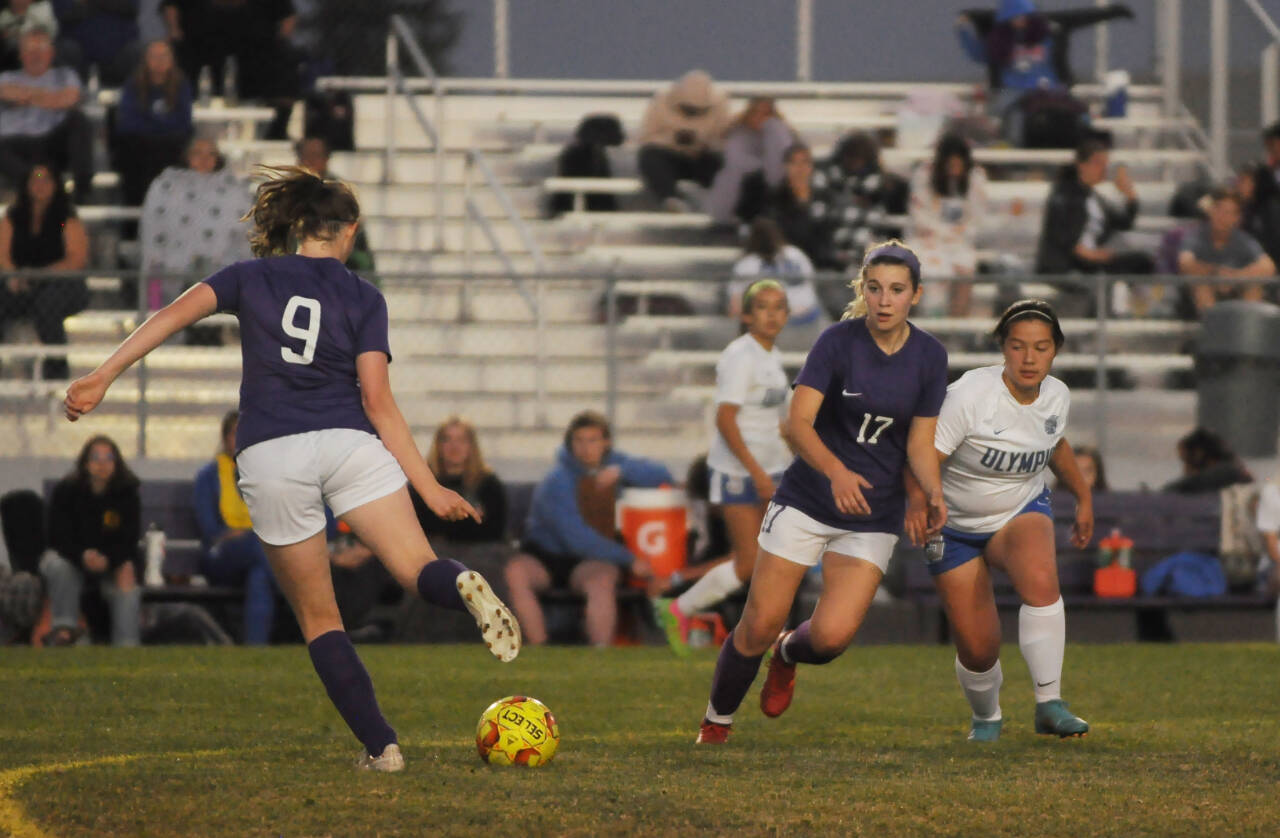Michael Dashiell/Sequim Gazette
Sequims Libby Turella, left looks for an open teammate as SHSs Kaia Lestage vies for position in the first half of the Wolves 6-1 win over Olympic on Sept. 20.