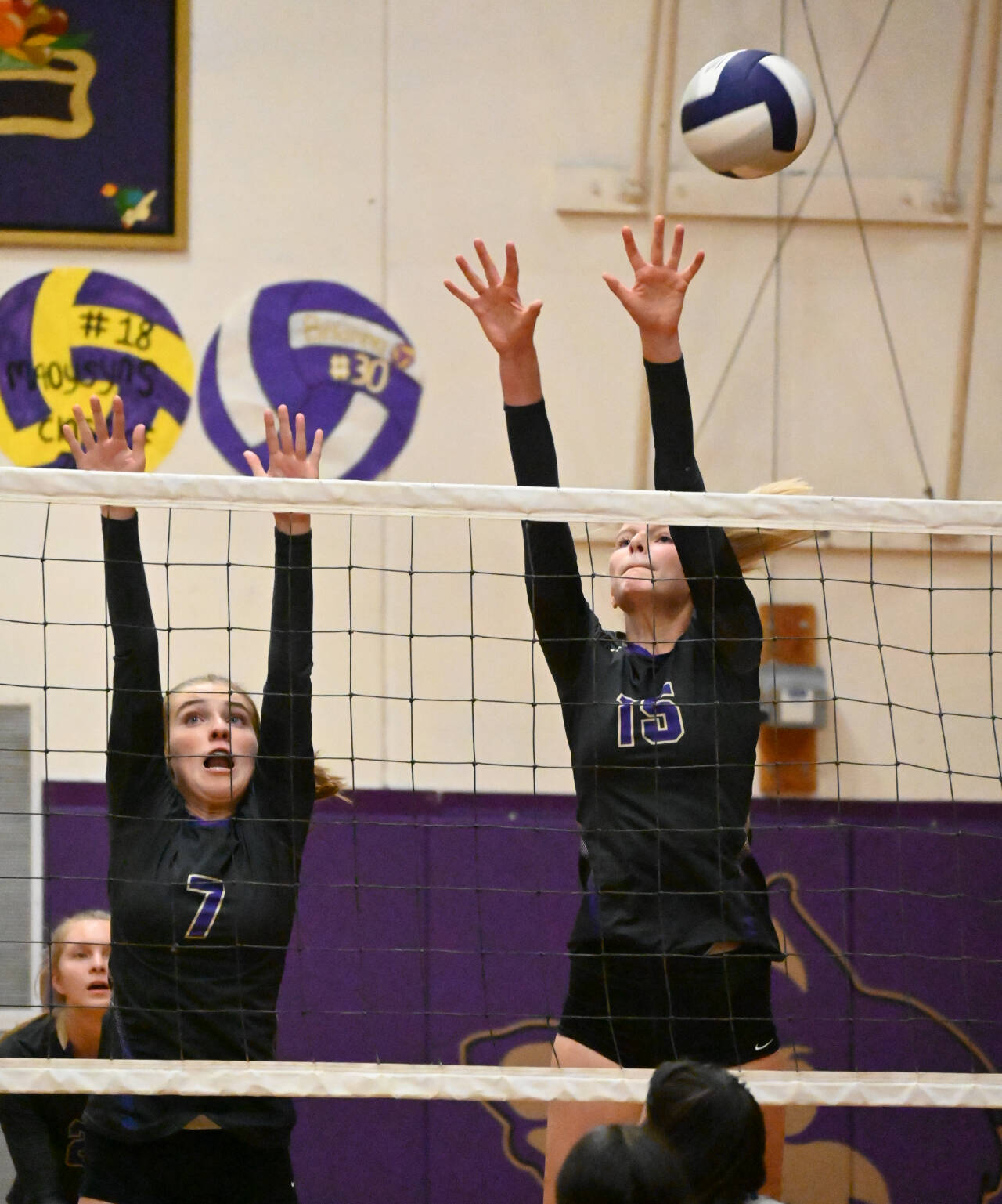 Sequim Gazette photo by Michael Dashiell / Sequims Sydney Clark, left, and Kendall Hastings vie for a block in the Wolves league match-up against Olympic on Sept. 20.