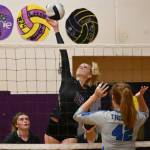 Sequim Gazette photo by Michael Dashiell / Sequim senior Kendall Hastings looks to hit a shot past Olympics Naomi Lipski as SHSs Jordan Kidd, left, looks on in a league match-up on Sept. 20.