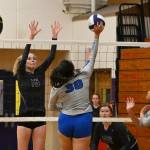 Sequim Gazette photo by Michael Dashiell / Sequim senior Kendall Hastings, left looks to block a shot by Olympics Erika Caryharius as SHSs Sammie Bacon looks on in a league match-up on Sept. 20.
