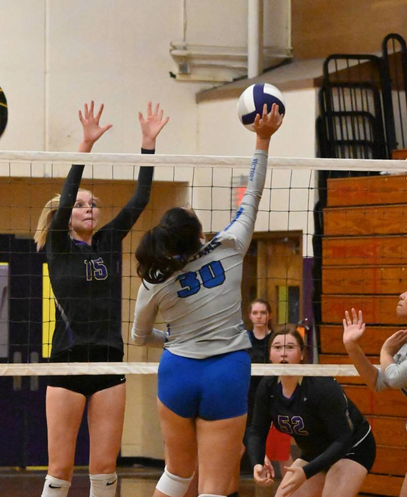 Sequim Gazette photo by Michael Dashiell / Sequim senior Kendall Hastings, left looks to block a shot by Olympics Erika Caryharius as SHSs Sammie Bacon looks on in a league match-up on Sept. 20.