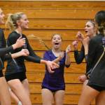 Sequim Gazette photo by Michael Dashiell / Sequim High volleyball teammates celebrate a point in the first game of a Sept. 20 league match-up against Olympic on Sept. 20.