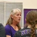 Sequim Gazette photo by Michael Dashiell / Sequim High volleyball coach Jennie Webber Heilman talks with her team in a home league match-up against Olympic on Sept. 20.