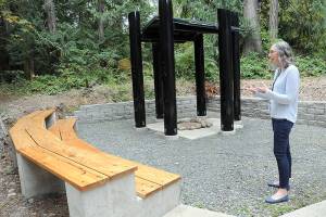 Sadie Crowe, steward for Peninsula College' House of Learning, talks on Friday about a "learning circle" for outdoor instruction behind the Longhouse on the Port Angeles campus. (Keith Thorpe/Peninsula Daily News)