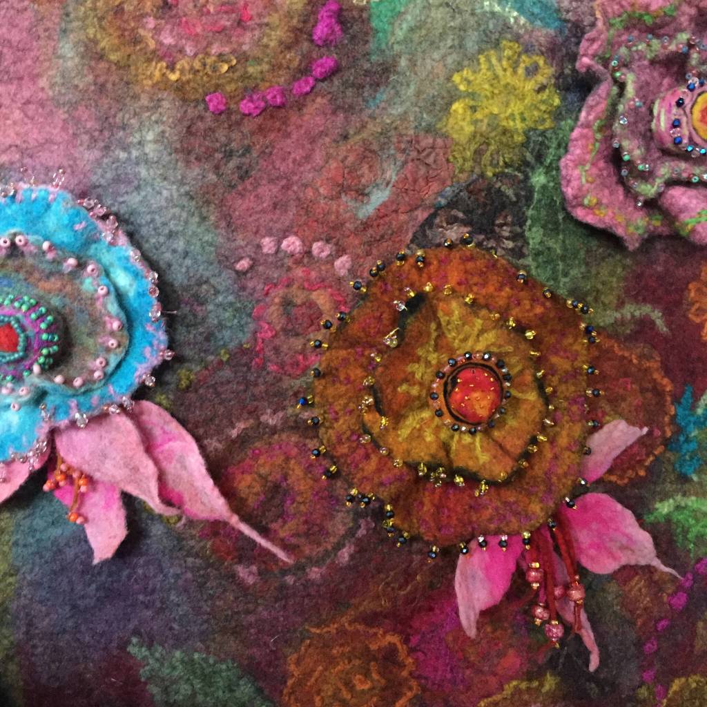 Submitted art / Floral Cascade by Lora Armstrong, a featured artist in the Interlaced Lore – Adventure, Fellowship, & Perseverance exhibit, part of the 17th-annual North Olympic Fiber Arts Festival.